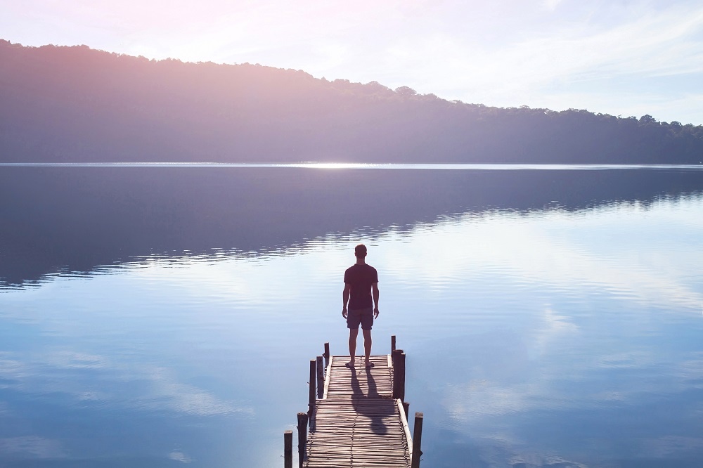 WEB Man looking over lake